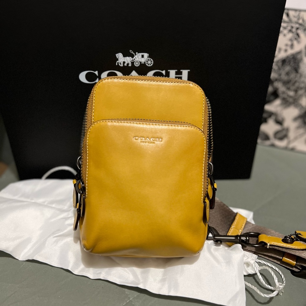 Gotham Sling Pack 13 In. Mustard yellow, two pockets. Crossbody.
